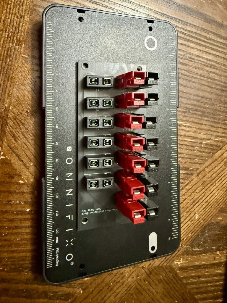 A completed MYOG Ham Radio distribution block with fuse holders.