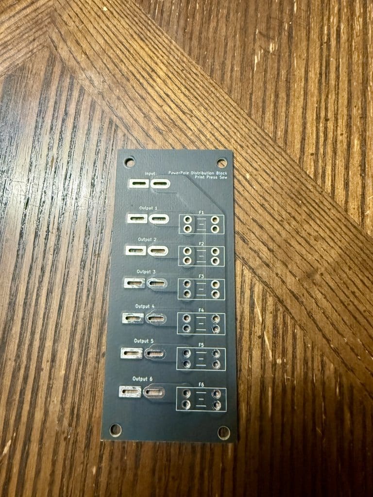 A blank PCB for a Ham Radio distribution block